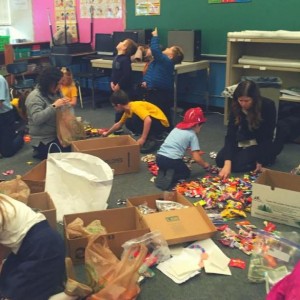 Sorting Halloween candy as part of our annual Share the Joy with Troops